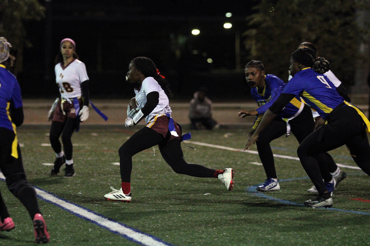Pahrump Valley High School freshman Ma'liyah Collins breaks away from double coverage during th ...