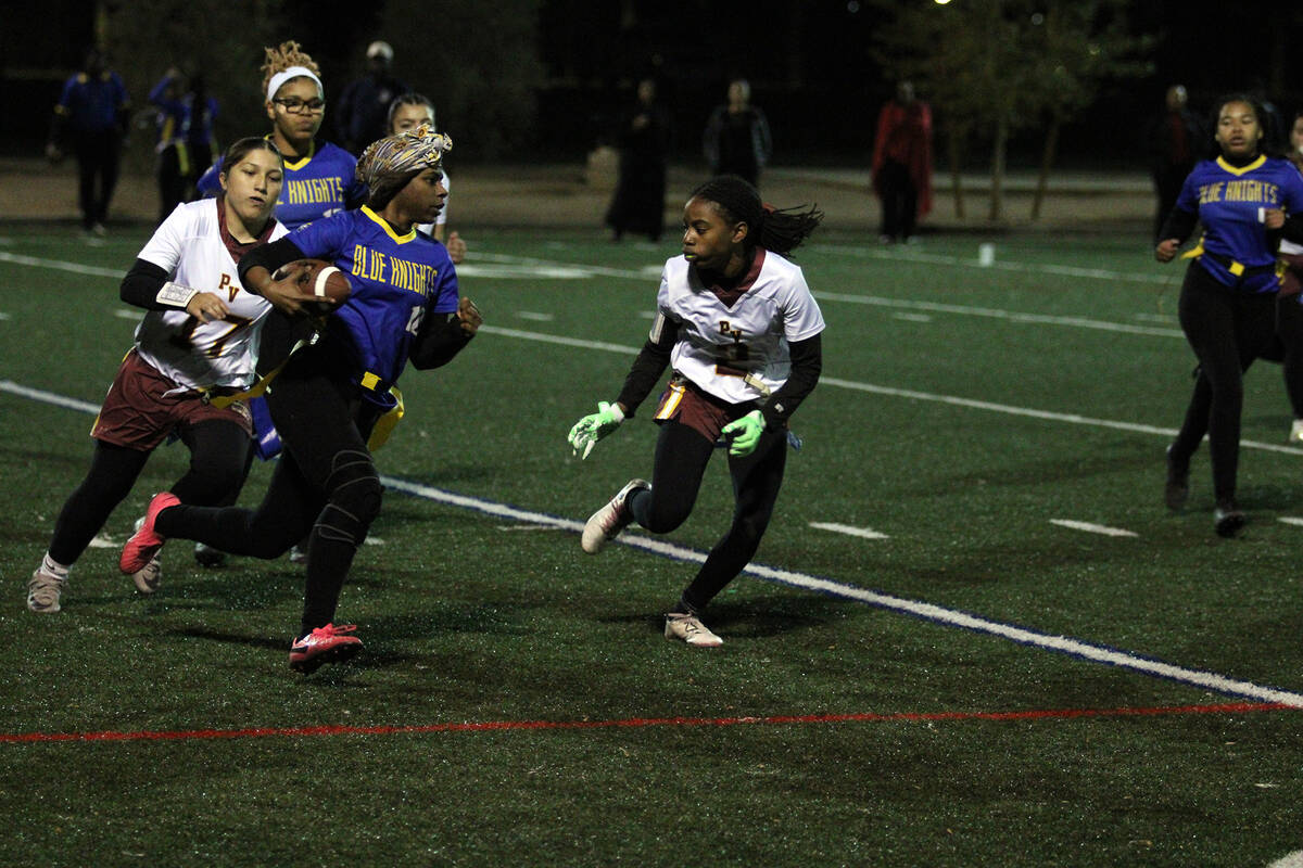 Pahrump Valley High School senior Diona Nixon attempts to get her hands on Democracy Prep senio ...