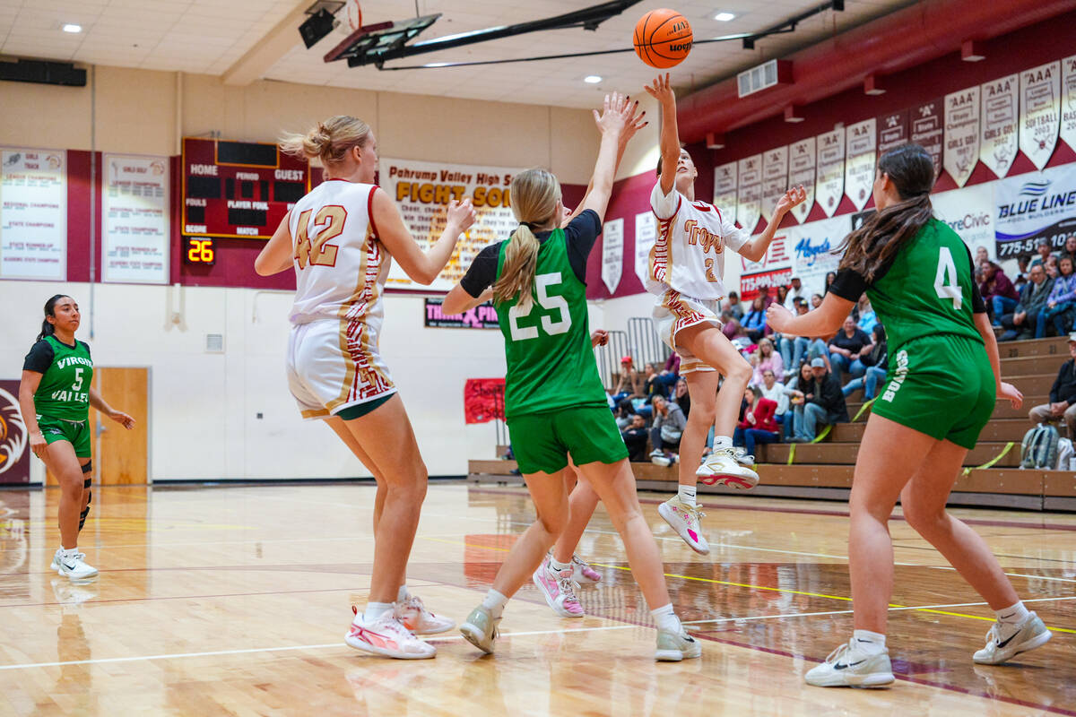 Pahrump Valley High School junior Addi Nelsen tosses up a layup attempt against Virgin Valley a ...