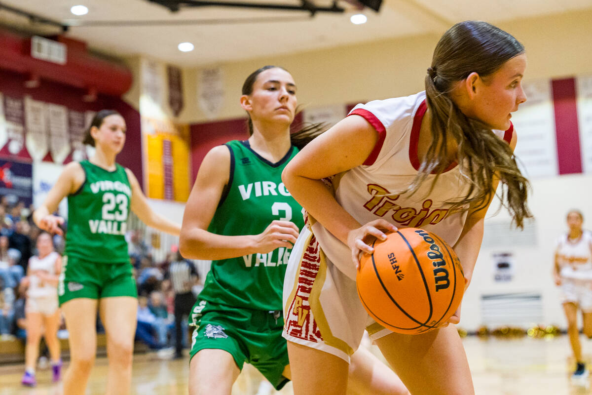 Pahrump Valley High School sophomore guard Ella Odegard secures the ball down low for a rebound ...