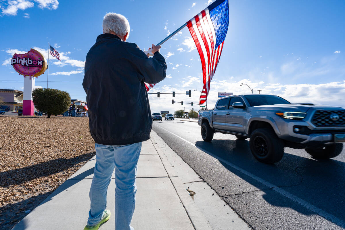 Many cars driving past the pro-Trump and pro-law enforcement rally honked, and some drivers eve ...