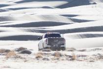 A truck drives on the Eureka Dunes in Death Valley National Park in California on Dec. 17, 2025 ...