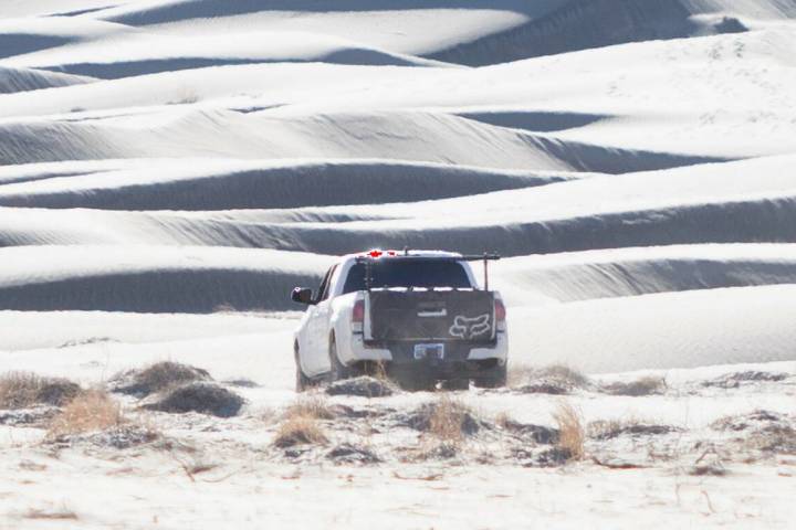 A truck drives on the Eureka Dunes in Death Valley National Park in California on Dec. 17, 2025 ...