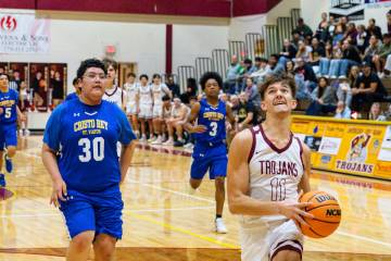 Pahrump Valley High School senior Aydon Veloz drives in for the layup against Cristo Rey St. Vi ...