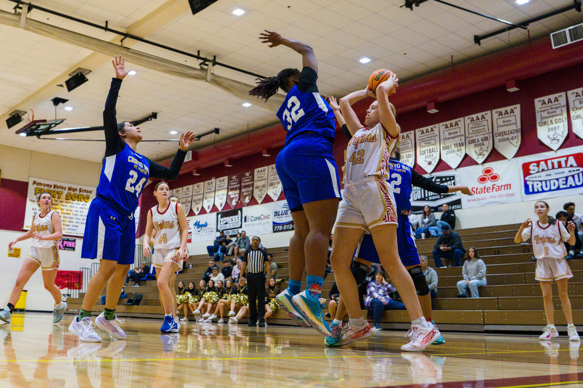 Pahrump Valley High School senior Julie Briggs stacks up against Cristo Rey St. Viator sophomor ...