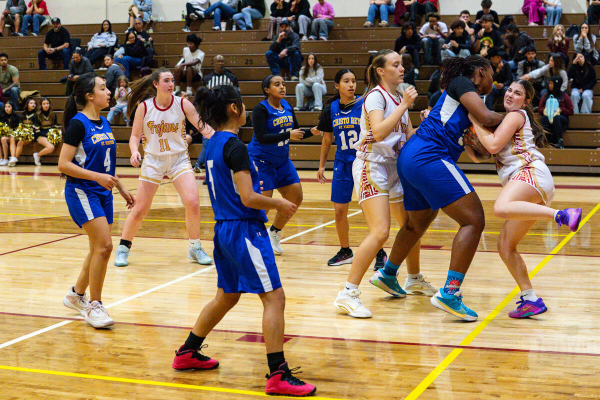Pahrump Valley High School junior Sydney Crotty attempts to wrestle the ball for a jump-ball po ...