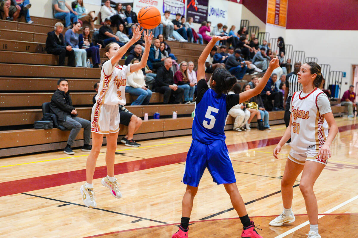 Pahrump Valley High School sophomore Addi Nelsen pulls up from three-point ranger over Royals s ...