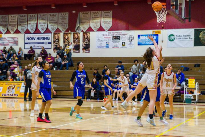 Pahrump Valley High School sophomore Kaitlyn Brown goes for a layup attempt against Cristo Rey ...