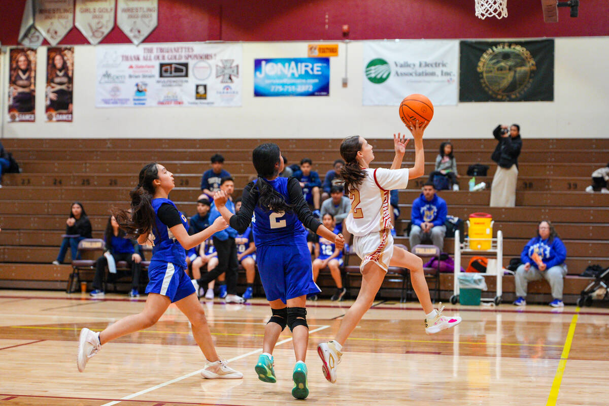 Pahrump Valley High School sophomore Addi Nelsen contributed nine points on the night to help d ...