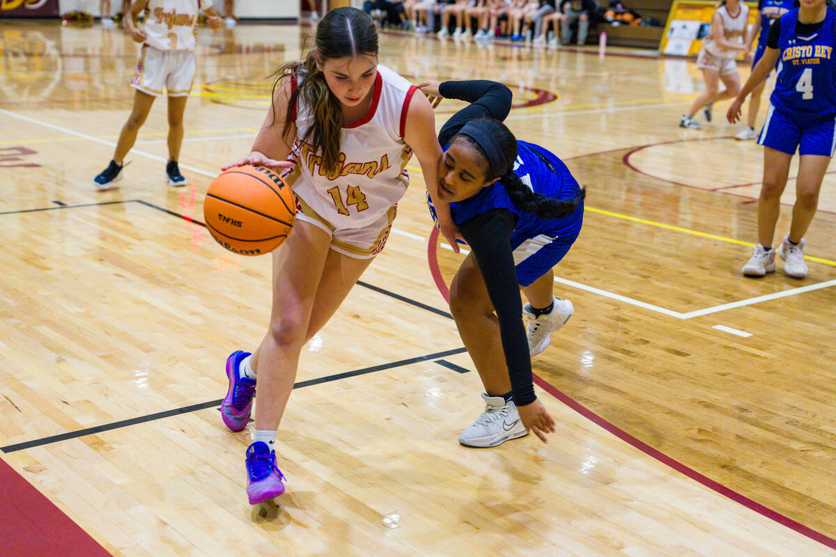 Pahrump Valley High School junior Sydney Crotty advances down the baseline of the Trojans' home ...