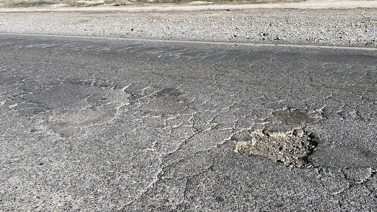 Blagg Road north of Bell Vista Avenue bears the marks of years of pothole patching, as well as ...
