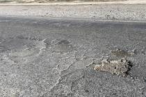 Blagg Road north of Bell Vista Avenue bears the marks of years of pothole patching, as well as ...