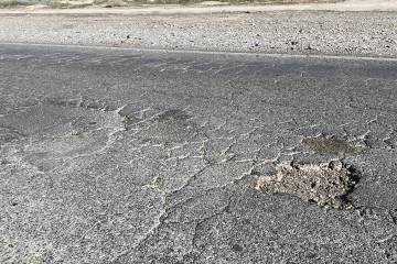 Blagg Road north of Bell Vista Avenue bears the marks of years of pothole patching, as well as ...