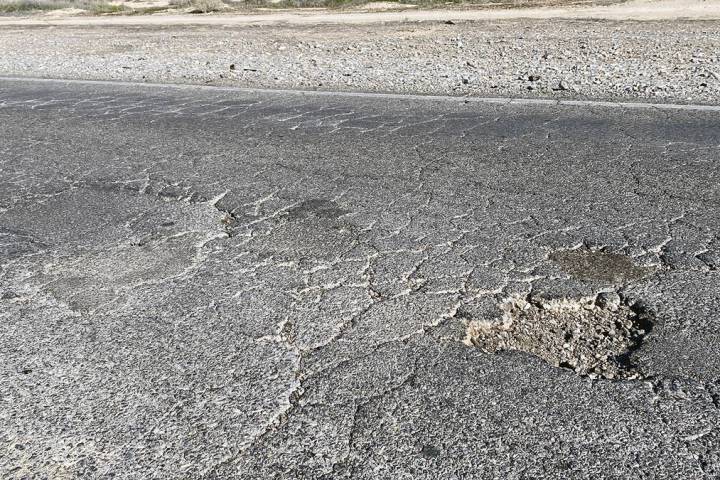 Blagg Road north of Bell Vista Avenue bears the marks of years of pothole patching, as well as ...