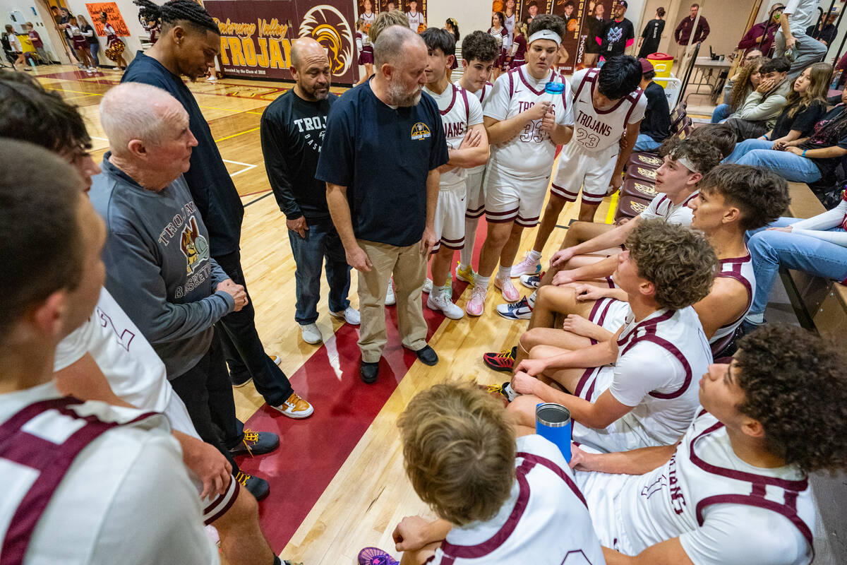 Pahrump Valley High School's boys varsity basketball program takes a timeout during their home ...
