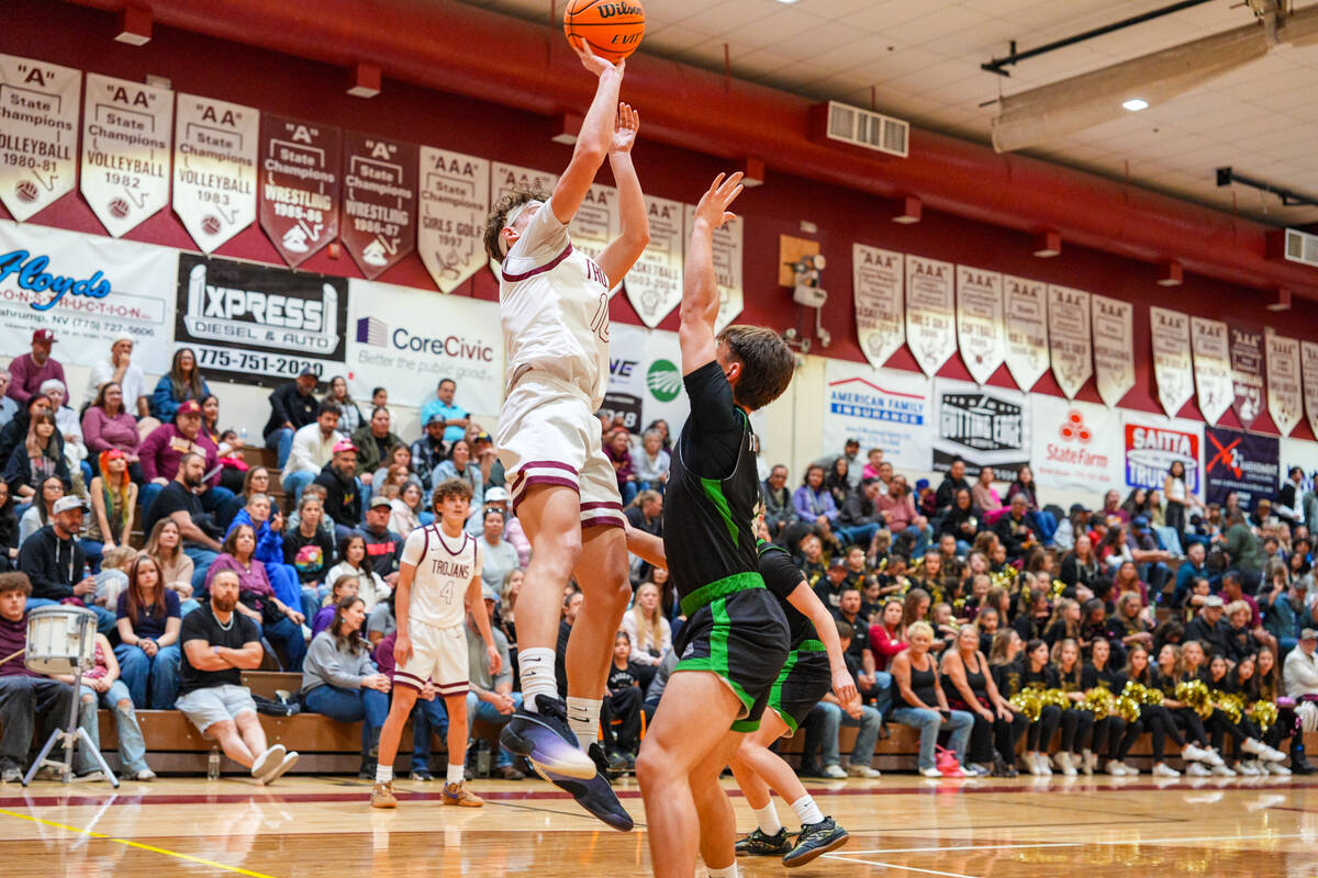 Pahrump Valley High School junior Lucas Gavenda pulls up for a jumper at home against Virgin Va ...