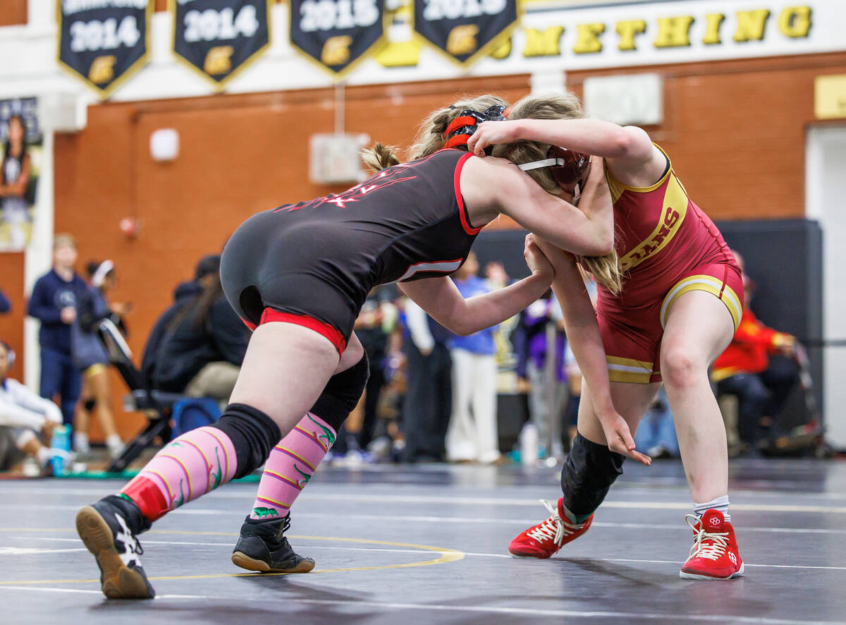 Patience Moore does her best to defend against Lincoln County High School’s Dani Peterson in ...
