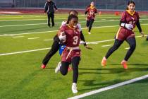 Pahrump Valley High School flag football's Ma'liyah Collins evades a defender during the Trojan ...