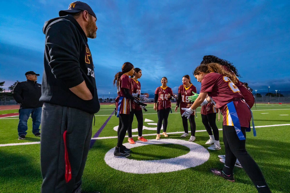 Head coach Jeff Corbett gives positive words of encouragement before the Trojans home game this ...