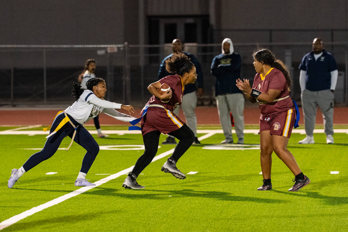 Pahrump Valley High School flag football senior Aaliyah Fries breaks away on a rushing attempt ...