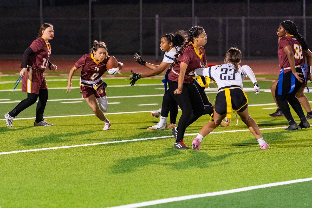 Pahrump Valley High School flag football sophomore Marlen Torres does her best to get through t ...