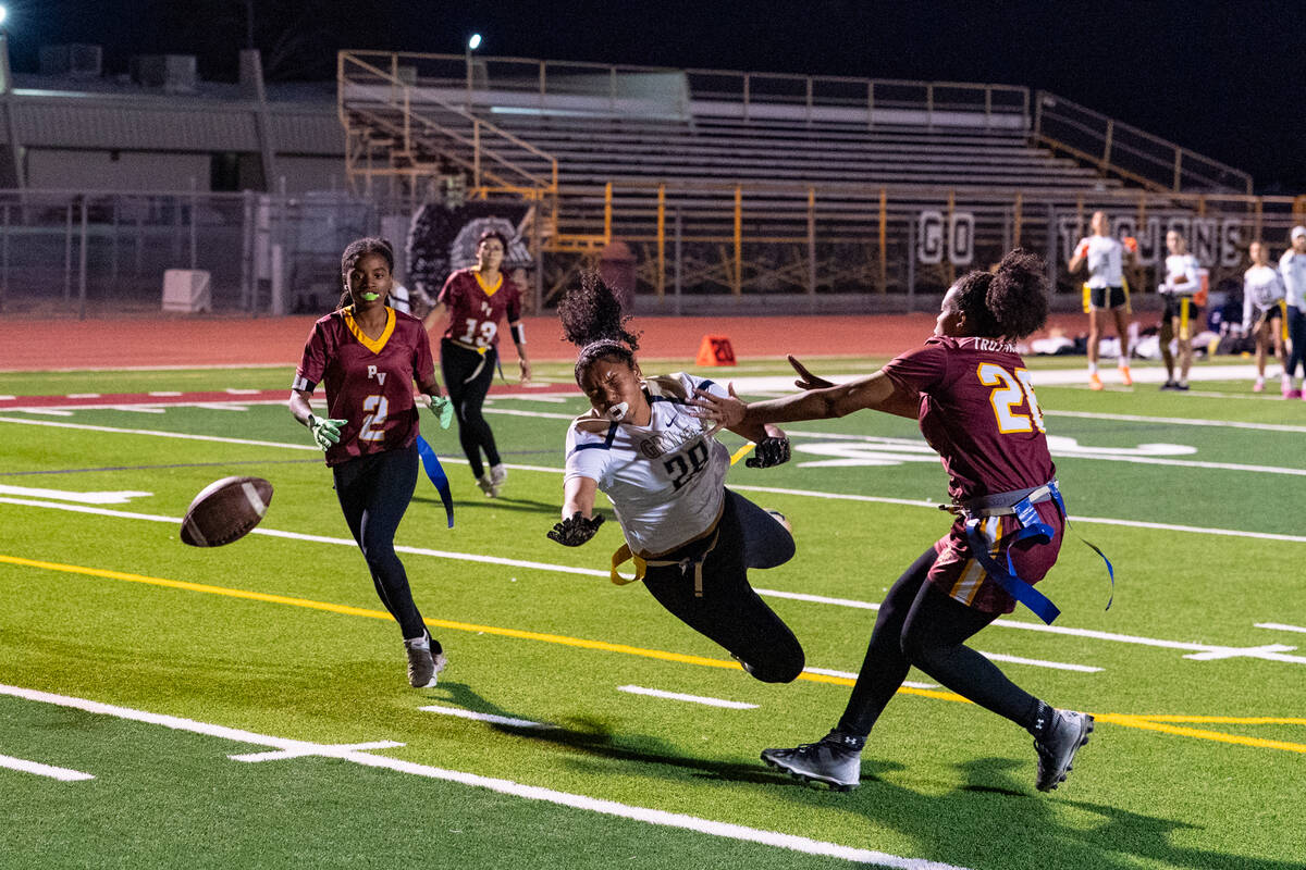Pahrump Valley High School seniors Aaliyah Fries and Diona Nixon attempt to break up a play on ...