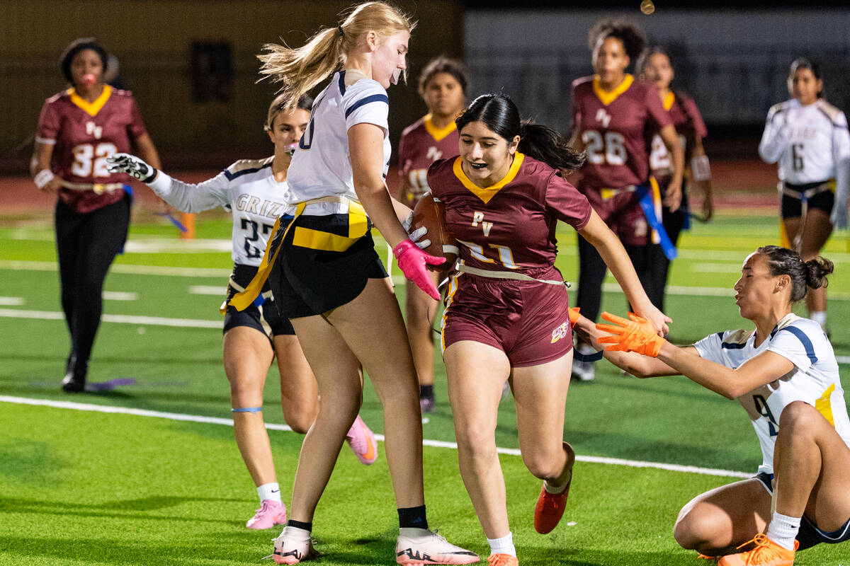 Pahrump Valley High School junior Stefani Jimenez Montoya tries to evade having her flags pulle ...