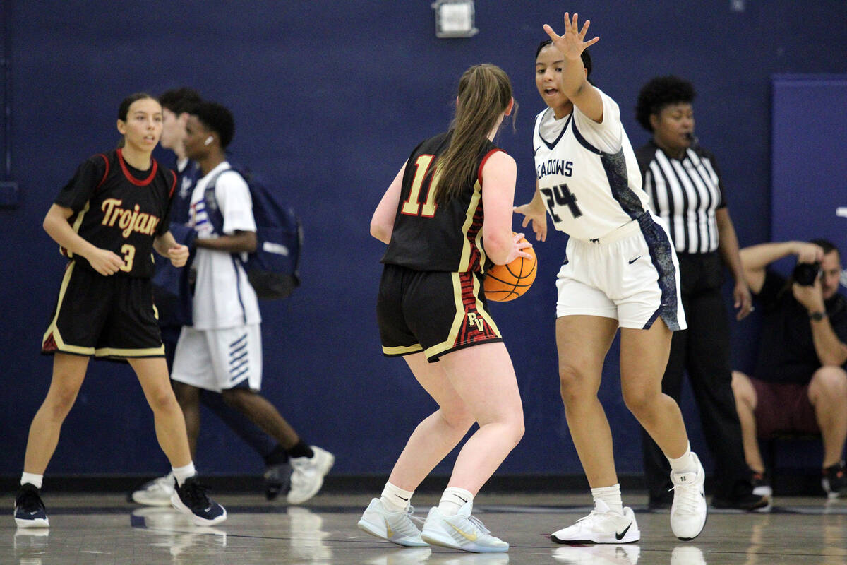 Pahrump Valley High School sophomore Kaitlyn Brown looks for an open teammate during the Trojan ...