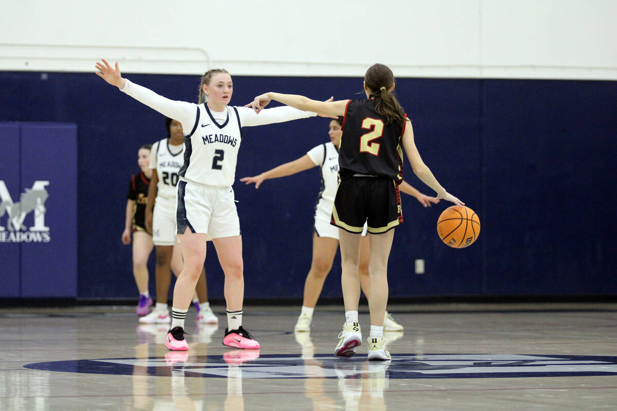 Pahrump Valley High School sophomore Addi Nelsen calls for isolation on offensive during the Tr ...