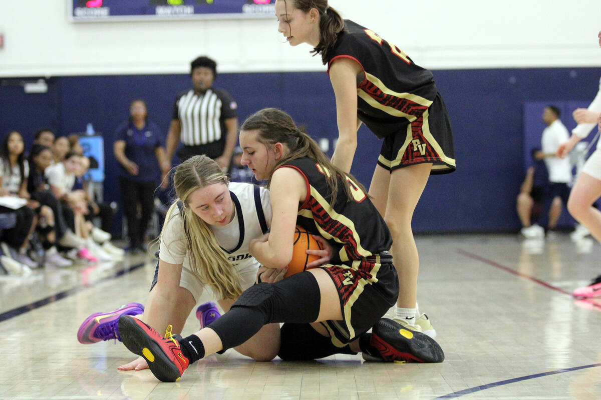 Pahrump Valley High School freshman Olivia Veloz fights for possession of the ball against The ...