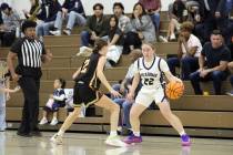 Pahrump Valley High School sophomore Addi Nelsen does her best to stick to The Meadows' freshma ...