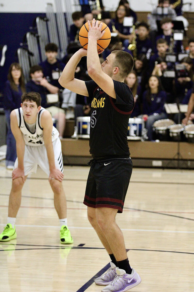 Pahrump Valley High School senior Joshua Slusher attempts to convert a free-throw against the M ...