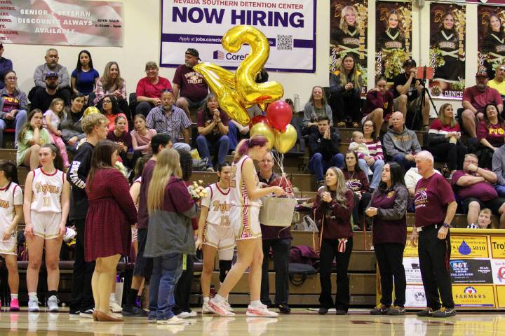 Pahrump Valley High School girls basketball senior Julie Briggs is honored with her friends and ...