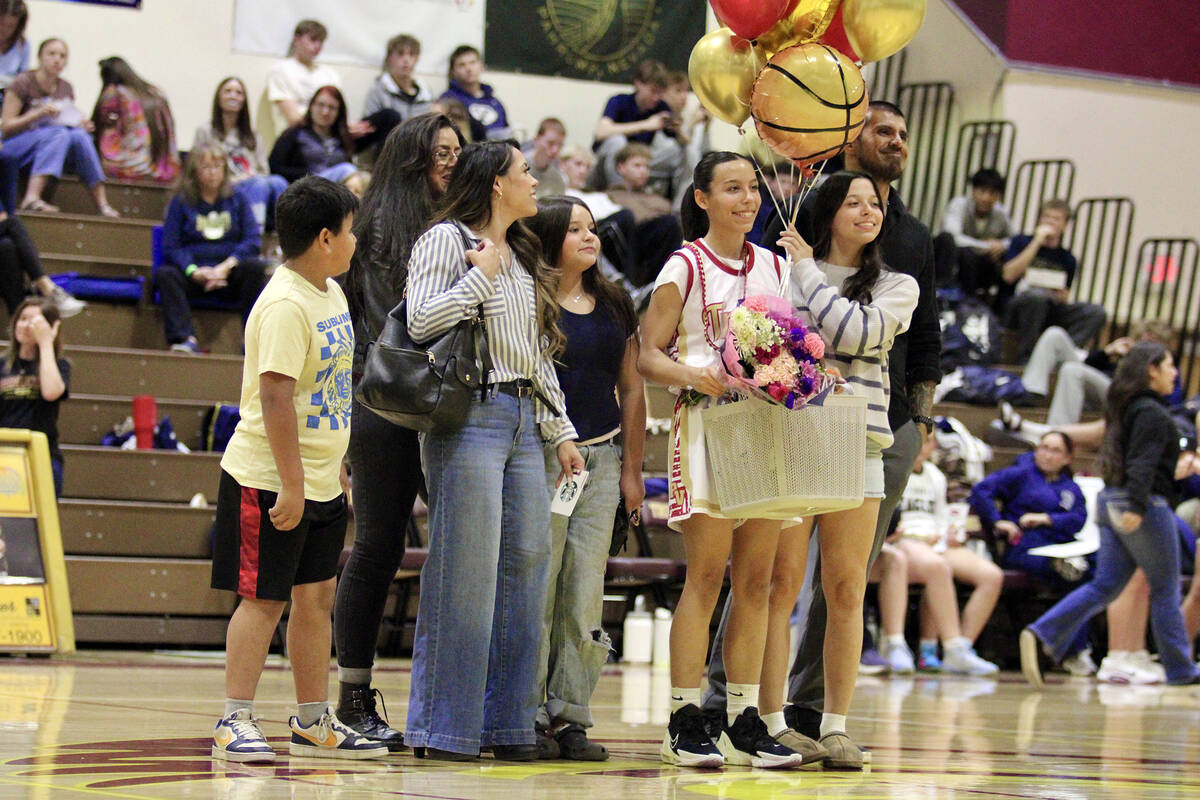 Pahrump Valley High School senior Jules Ondrisko is honored with her family members and support ...