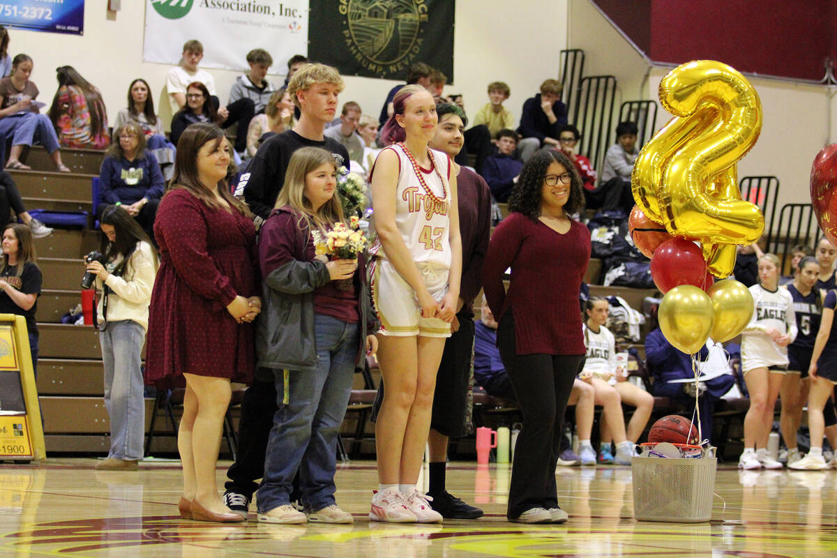 Pahrump Valley High School girls basketball senior Julie Briggs is honored with her friends and ...