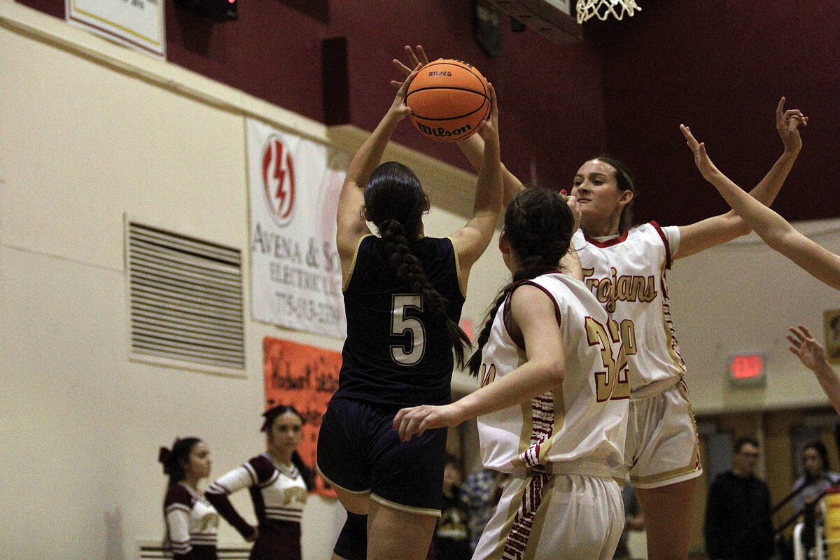 PVHS junior Riley Saldana attempts to block a shot attempt from Boulder City senior Kendall Sha ...