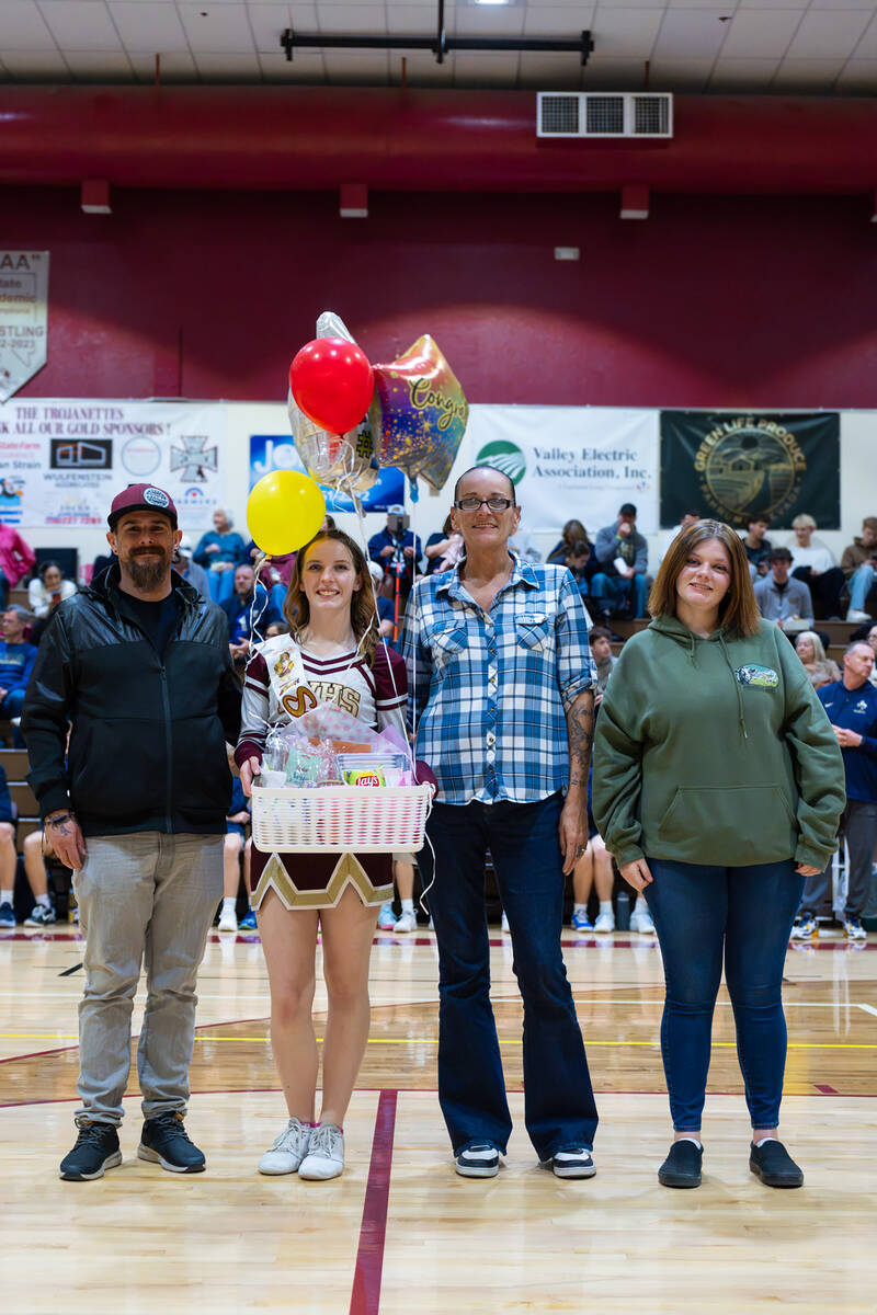 Pahrump Valley High School senior Kyndra Cardwell is celebrated by her family during the Trojan ...