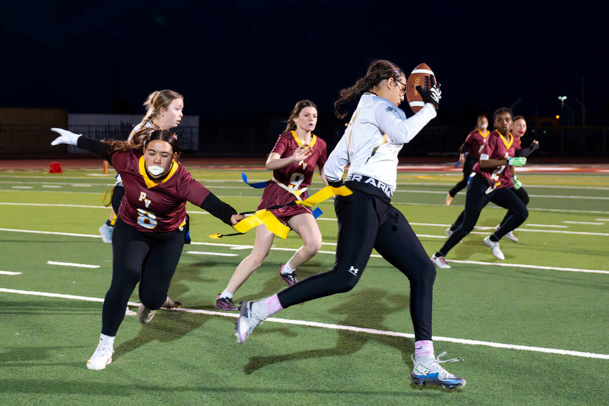 PVHS senior Leah-Marie Cooper attempts to get a flag pulled against Amplus Academy at home on F ...