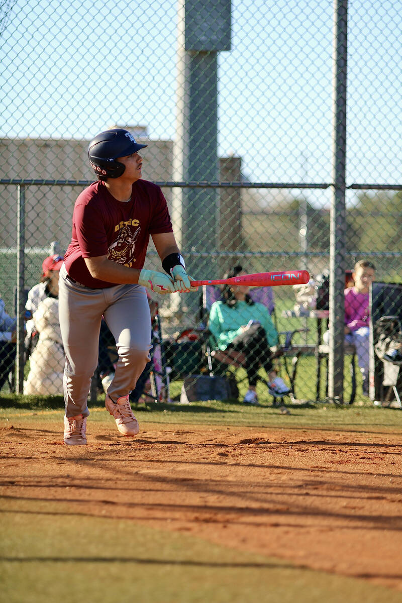 Pahrump Valley High School sophomore CJ Nelson gets out of the batters box in a hurry following ...