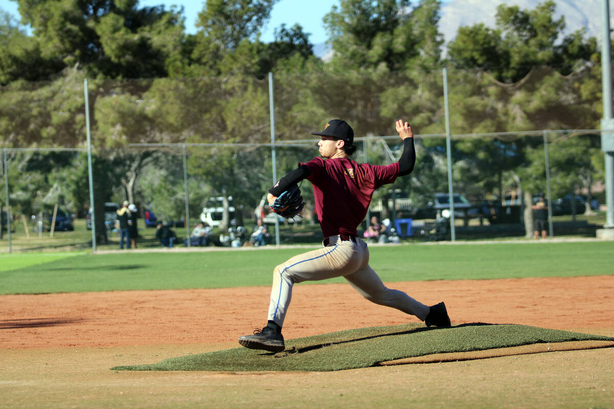 Pahrump Valley High School junior Tony Whitney delivers to the plate during the Trojans scrimma ...