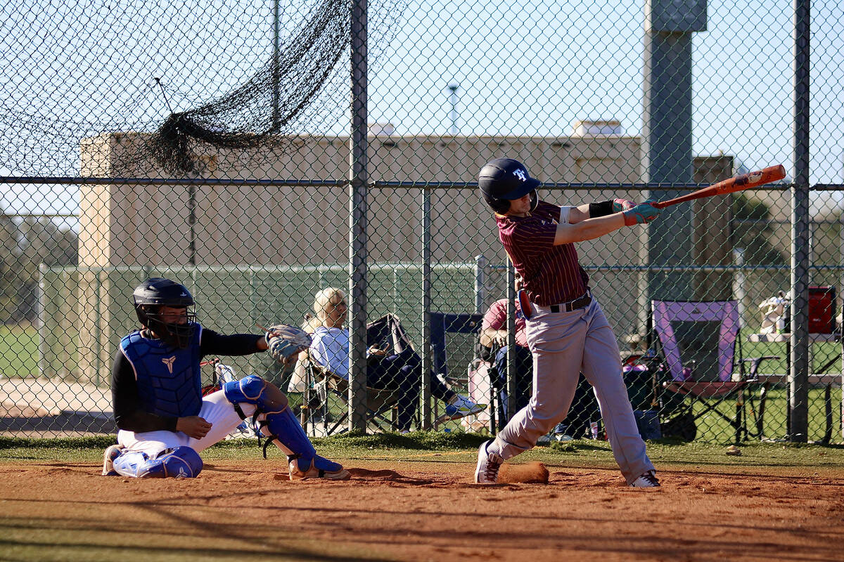 Pahrump Valley High School sophomore Anthony Montanez squares up a ball up the middle for a sin ...