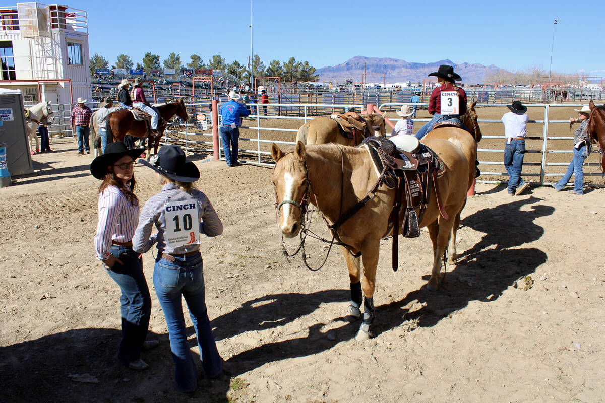 Riders waiting for their turn in the event chat among themselves at the Pahrump Valley Junior H ...