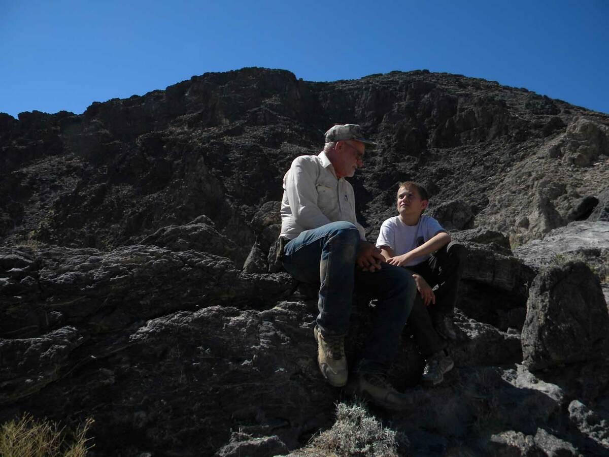 Eddie Pribble and James Reddick take a rest while working at a project to repair and maintain g ...