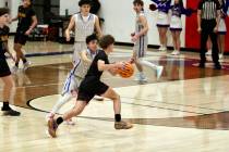 Pahrump Valley High School senior Keir Sheppard tries to get past GV Christian guard Wake Rolwi ...