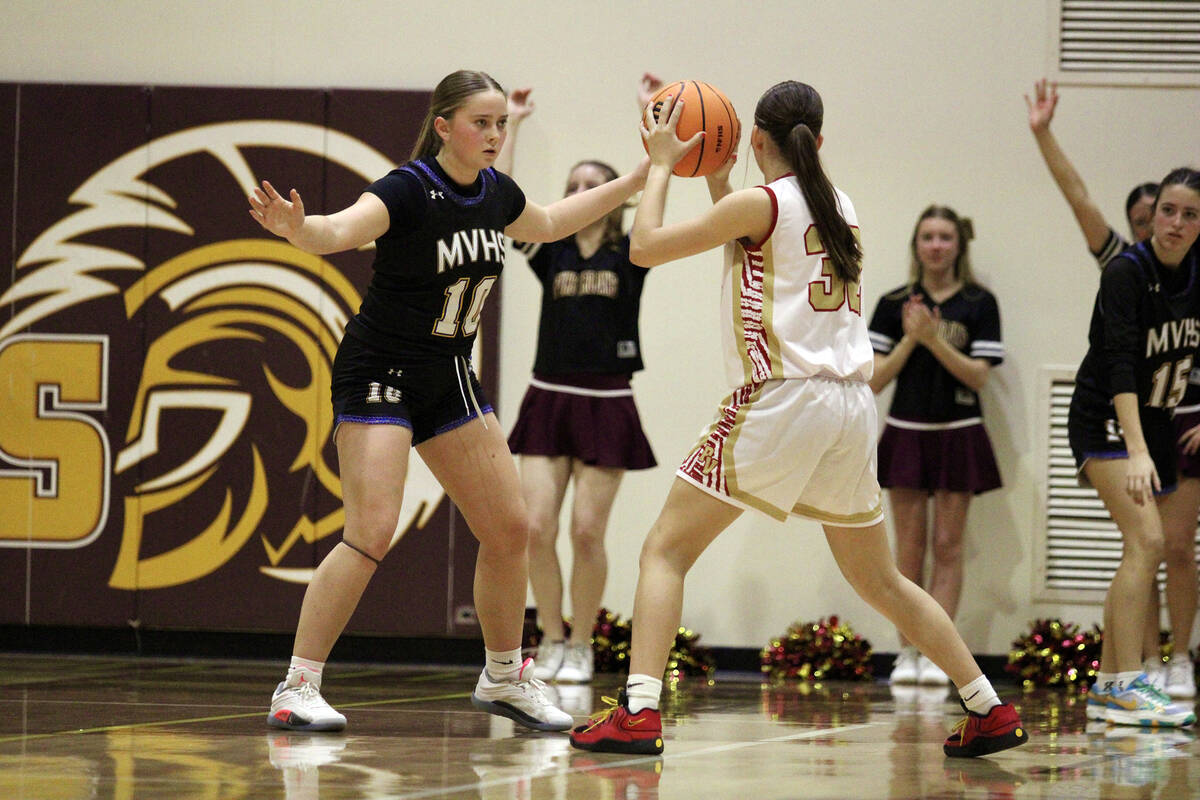 Pahrump Valley High School freshman Olivia Veloz looks for an open man to pass the ball to duri ...