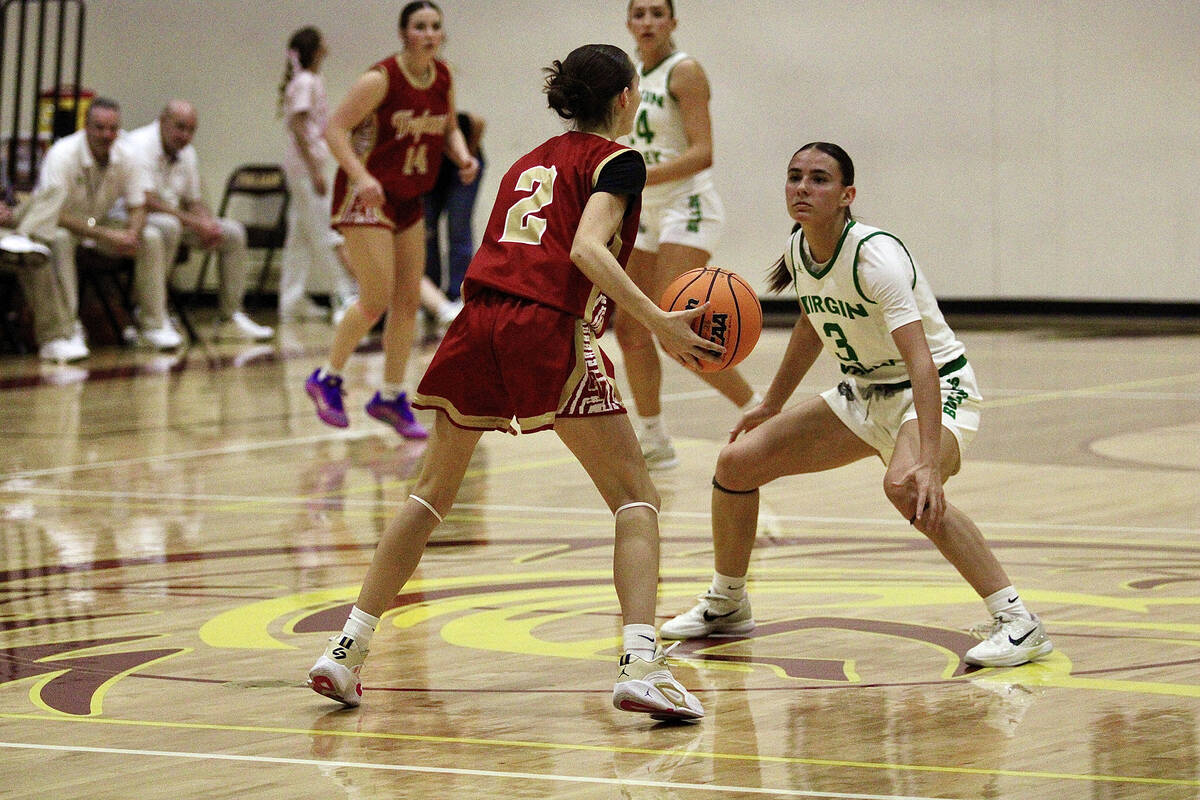 Pahrump Valley High School sophomore Addi Nelsen sizes up Virgin Valley senior co-captain Julia ...