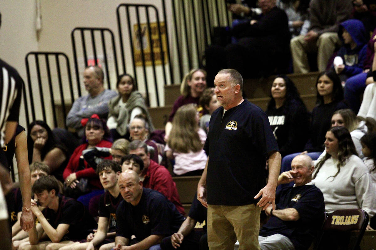 Trojan first-year head coach Toby Henry shows his discontent with the officials during the Clas ...