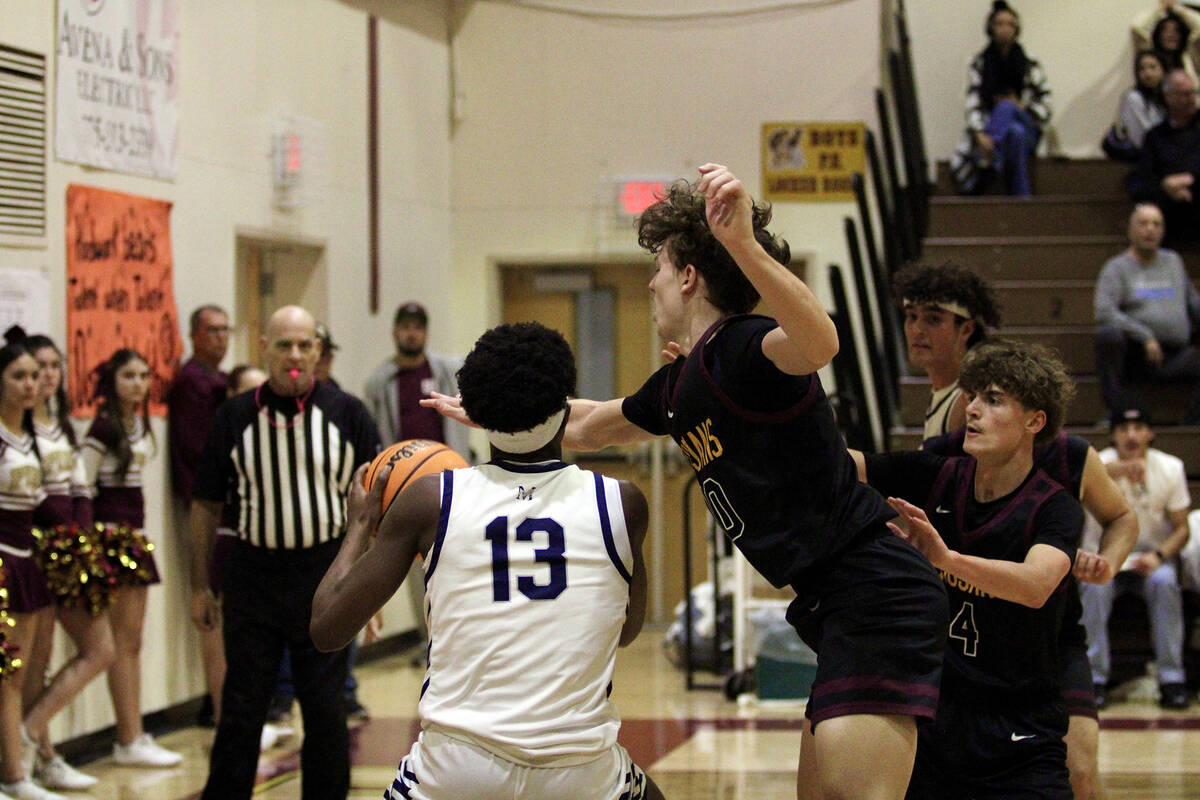 PVHS defenders Lucas Gavenda and Keir Sheppard do their best to double-team The Meadows' Uzo Nw ...