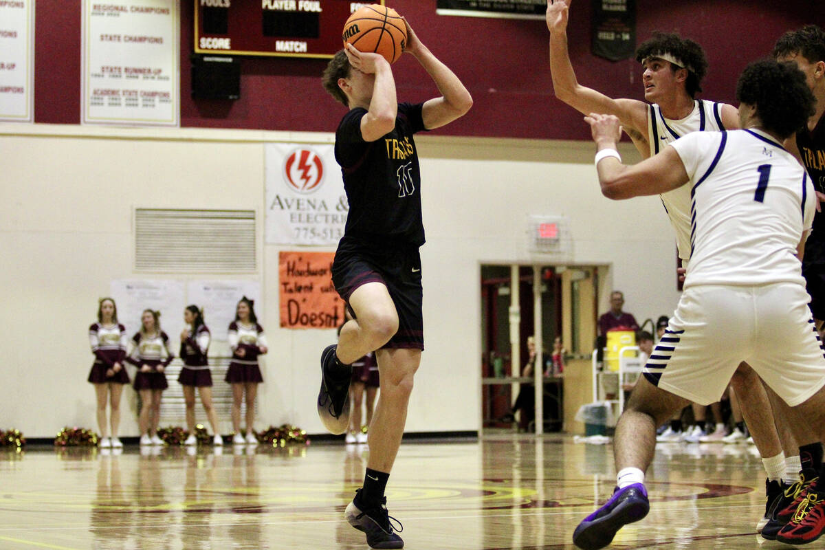 PVHS junior Lucas Gavenda throws up a three-point attempt against The Meadows during the Class ...