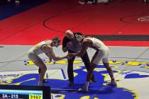 Pahrump Valley High School junior Iyan Bosket shakes hands with his opponent Terrance Mattson b ...